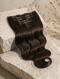 Seamless clip-in hair extensions bundle, dark brown wavy strands with comb clips