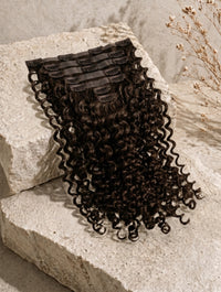 Seamless clip-in hair extensions bundle, dark curly strands with comb clips