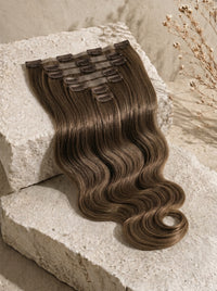 Dark brown body-wave weft with clip tabs on hairpiece