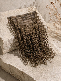 Curly dark brown weft with multiple clip tabs hair extensions