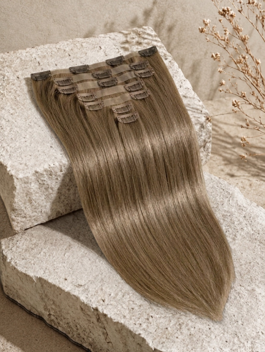 Seamless clip-in extensions, long straight-to-wavy dark-brown hair weft with clips