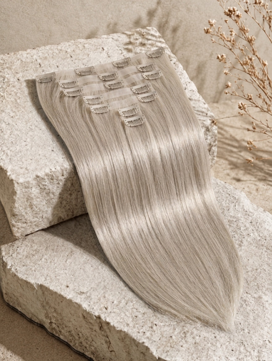 Seamless clip-in extensions with straight-smooth weft, light silver blonde