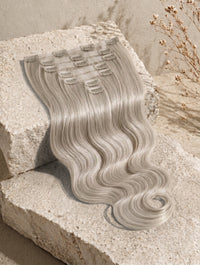 Seamless clip-in extensions with wavy hairpiece, light silver-gray blonde