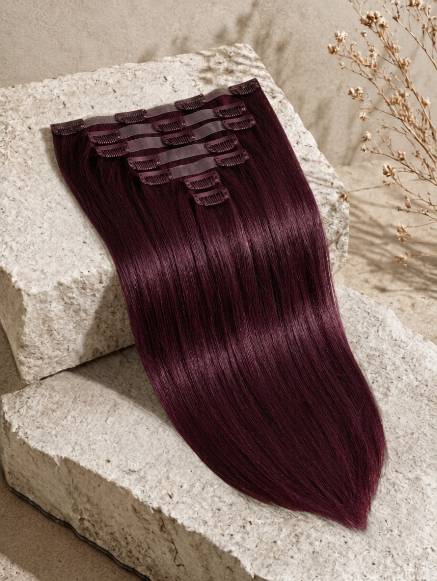 Burgundy clip-in hair extension bundle with smooth straight hair strands