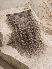 Seamless hair extension weft in ash blonde, curly hair strands