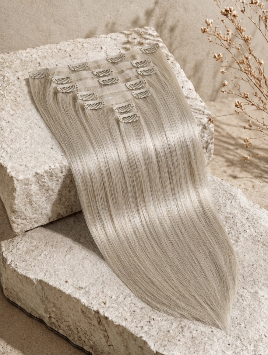 Seamless clip-in hair extension weft, ash-blonde straight strands with clips