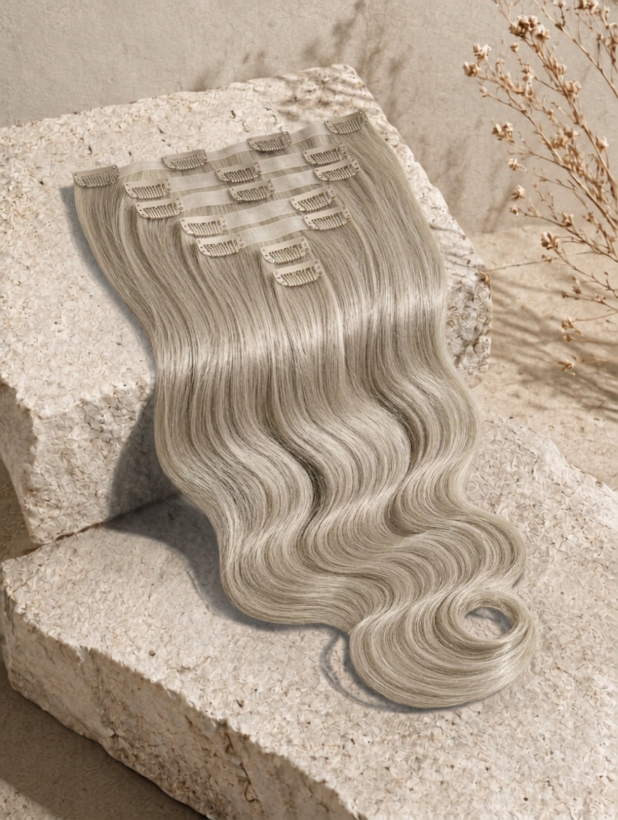 Clip-in hair extensions weft with long body-wave curls, ash blonde