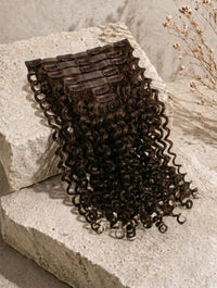Seamless clip-in hair extensions, dark brown curly waves with comb clips on top
