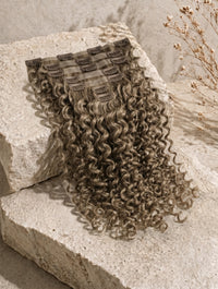 Curly seamless clip-in extensions, long cool gray hair with attached clip weft