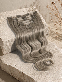 Seamless clip-in hair extensions, long light ash blonde waves with clip weft