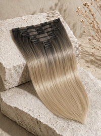 Seamless clip-in hair extensions in cool beige blonde, straight long weft with clips