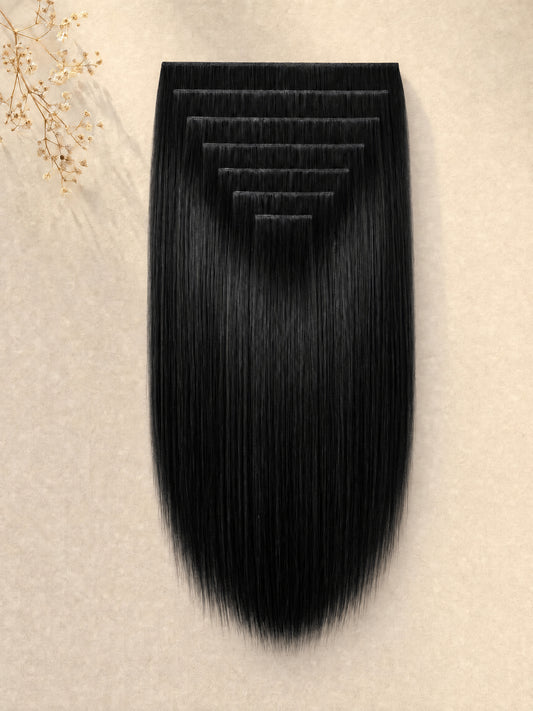 Black wavy clip-in hair extension weft, curled strands on a rectangular base