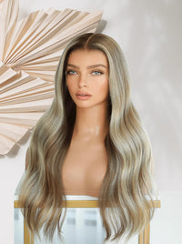 Glueless lace wig with long wavy light blonde hair and center part