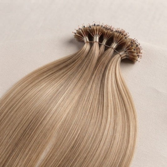 Hair extension strands with small loop beads; light blonde