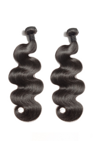 Two dark wavy hair bundles with tight curls at the ends