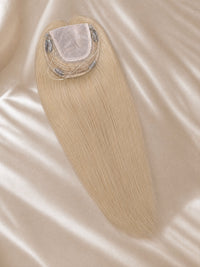 Light-blonde lace hair topper with visible lace base and fine hair strands