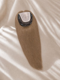 Light-blonde lace hair topper with circular lace base and dark clip area