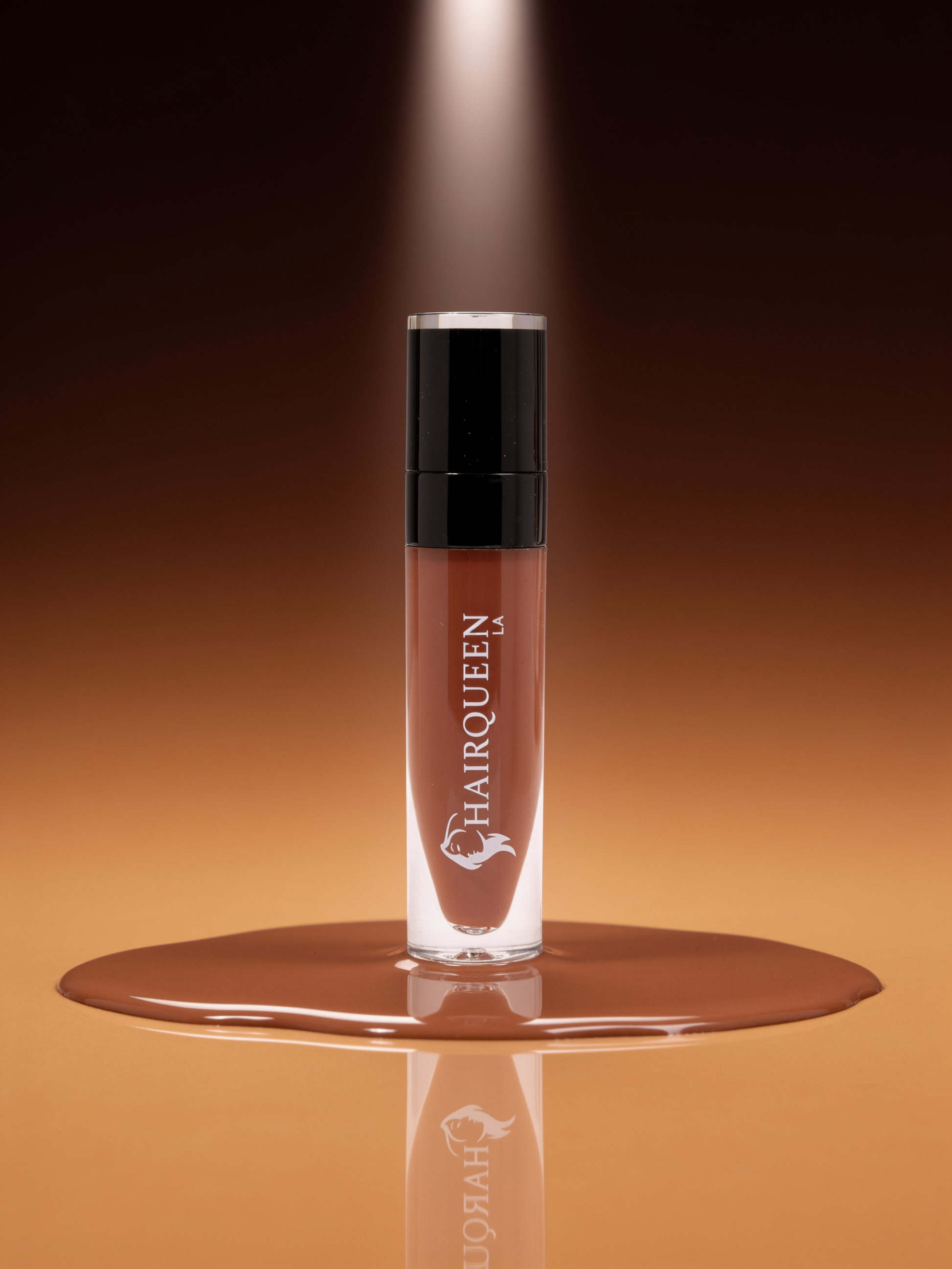 Clear HAROQUEEN lip gloss tube with black cap, nude beige liquid in applicator