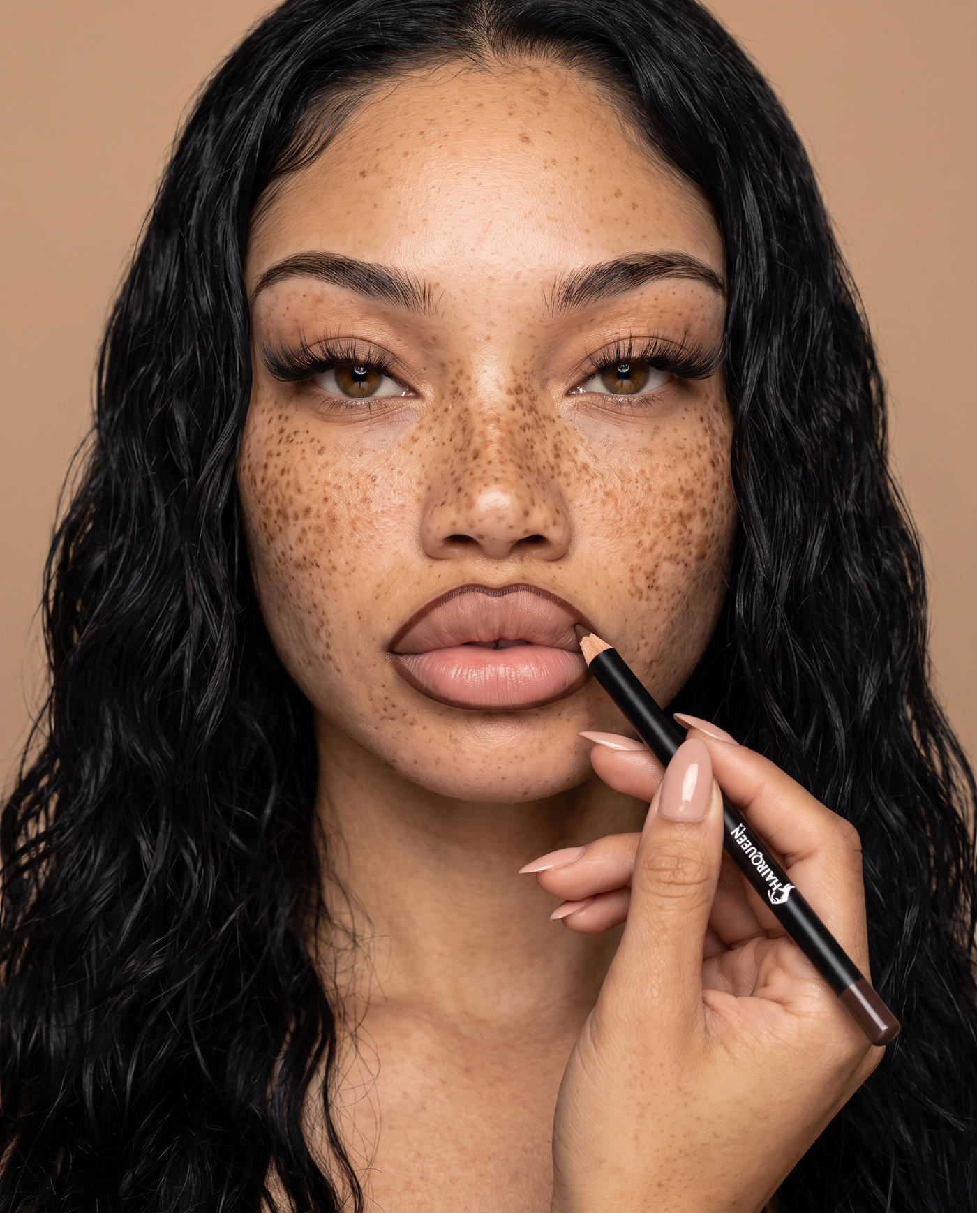 Woman applying nude-brown lip gloss with wand, glossy lips finish
