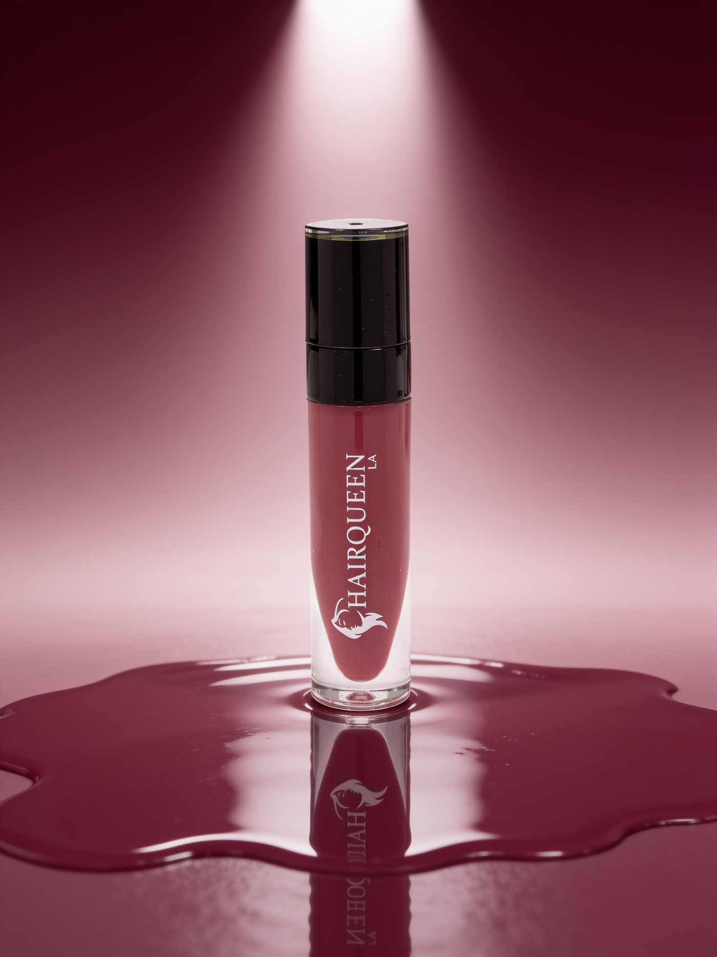 Clear HAROQUEEN lip gloss tube with black cap, deep berry gloss swatch