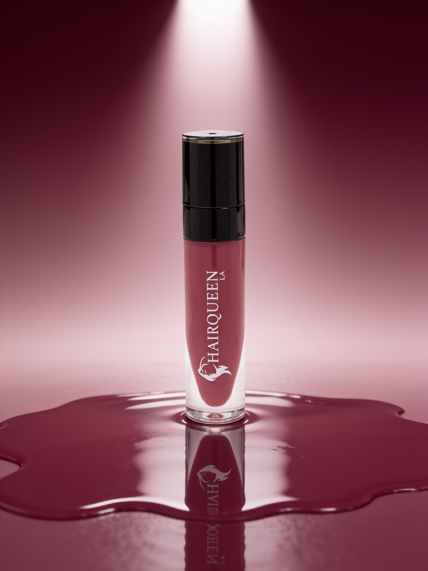 Clear HAROQUEEN lip gloss tube with black cap, deep berry gloss swatch