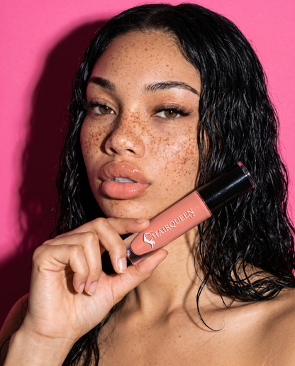 Lip kit on lips: rose nude gloss with slender applicator held near mouth