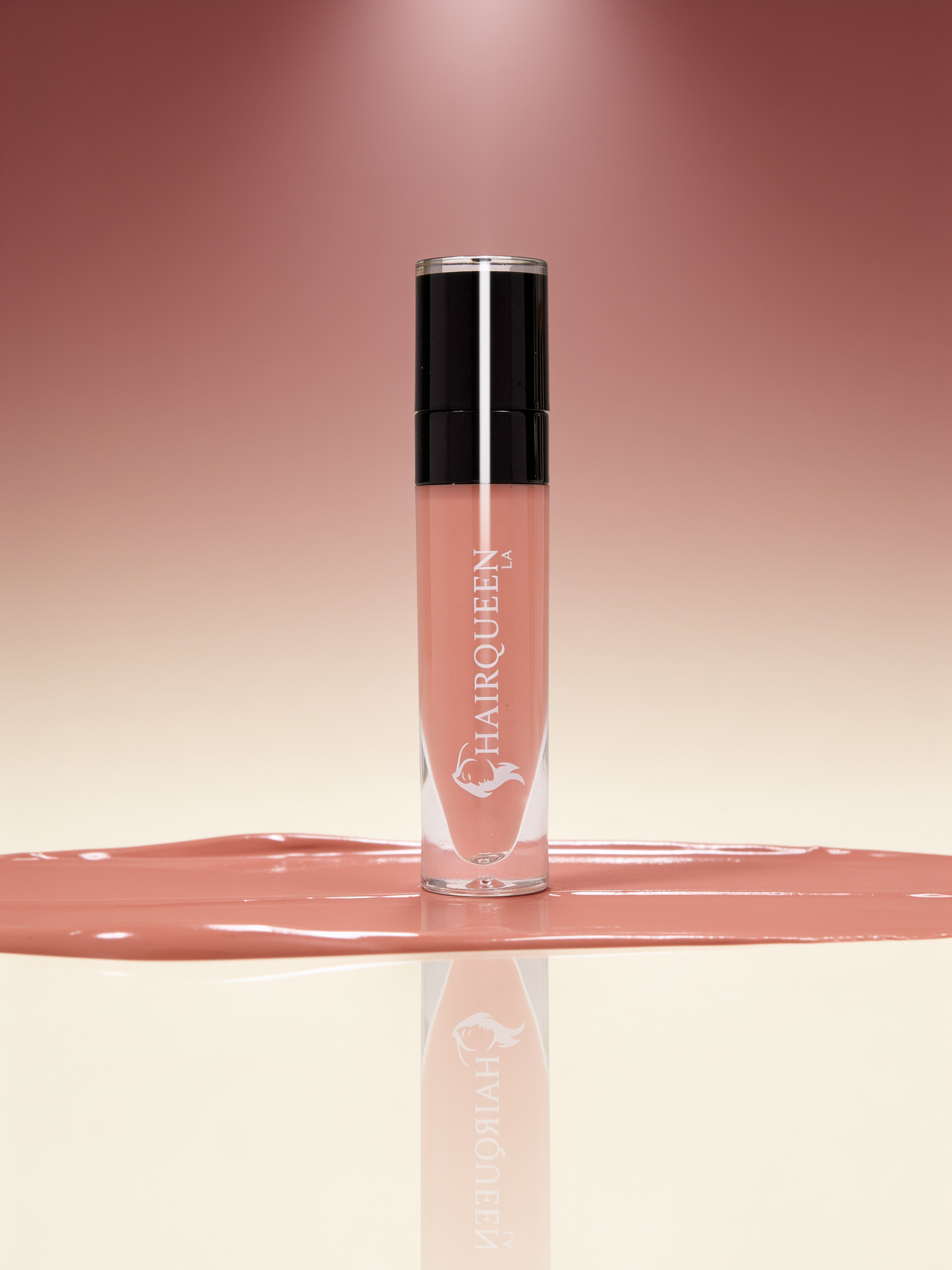 Clear HAROQUEEN lip gloss tube with black cap, nude beige gloss swatch