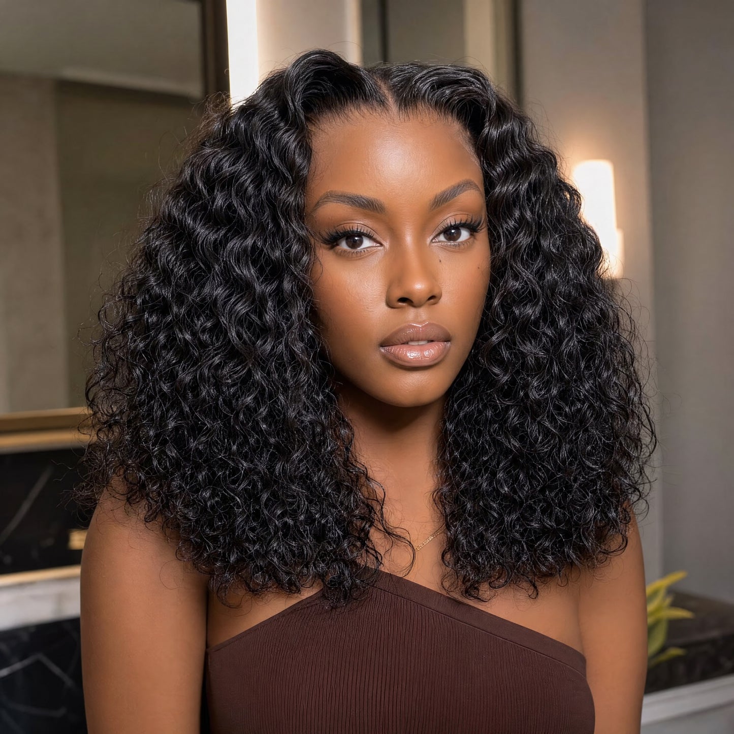 Black lace front wig with voluminous loose deep curls and natural part