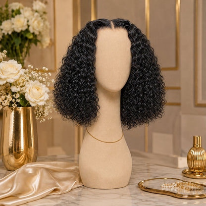 Black lace front wig on mannequin, voluminous loose deep curls at shoulder length