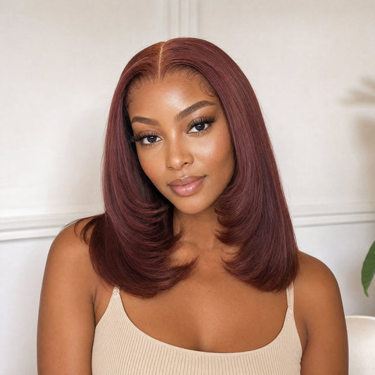 Sariyah lace wig in burgundy, close-up of sleek bob with layered waves and side part.
