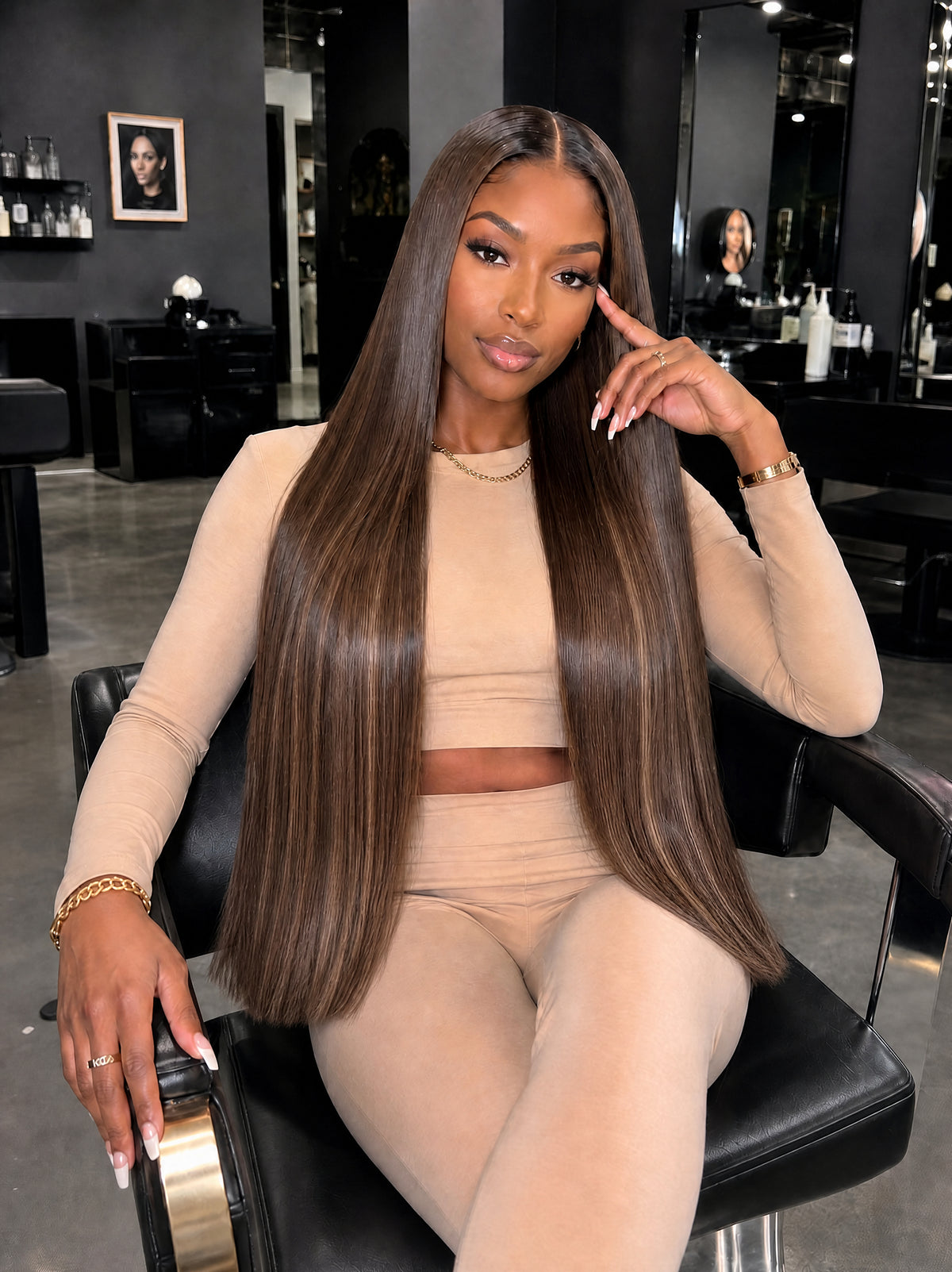 Long dark brown straight hair bundle with center-parted, silky ends.