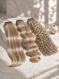 Set of four blonde hair extensions bundles with mixed wave and curl styles