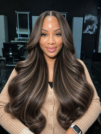 Long dark brown wavy hair bundle with soft curls and center part.