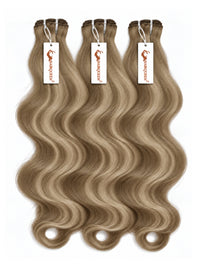 Highlighted hair bundles with loose wavy light brown strands, three wefts with hanging labels