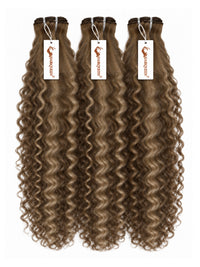 Three hair weave bundles with curly light brown streaked highlights, tied with tags
