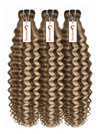 3 curly hair bundles with darker brown roots and caramel-brown curls, hanging bundles.