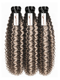 Three hair bundles with tight curly dark brown and gray highlights, with tags