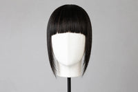 Straight black bangs on mannequin head, full fringe with blunt ends
