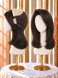 Deep dark wig with side part, shoulder-length layered bob, on a mannequin head