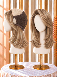 Light blonde wig with dark roots, shoulder-length layers, side-parted on a mannequin head