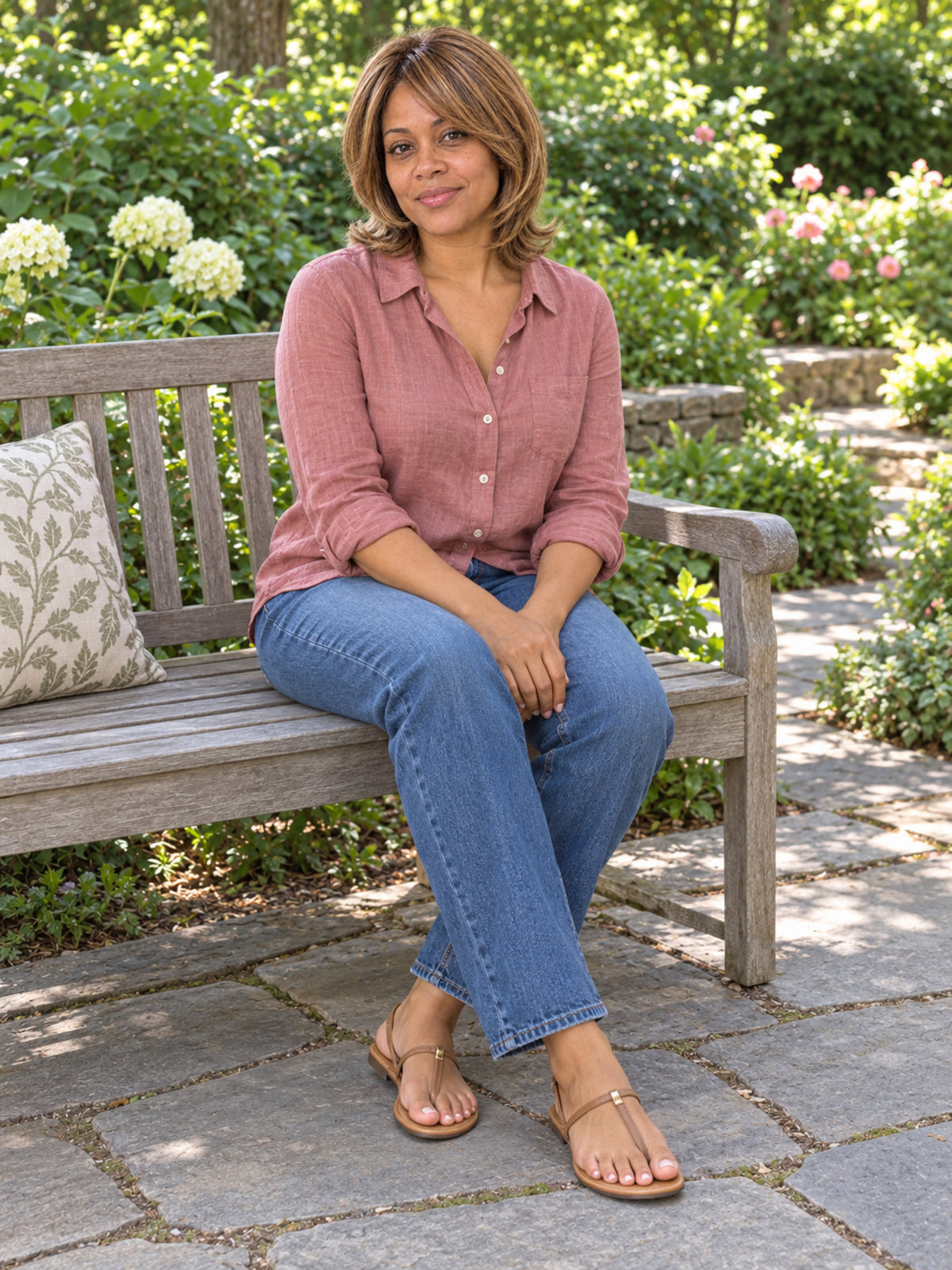 Short bob wig in light brown on a woman outdoors, layered waves and side part