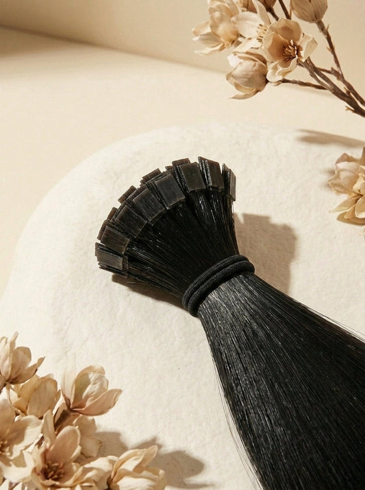 Close-up of K-Tip hair extensions: dark pre-bonded tips attached to hair