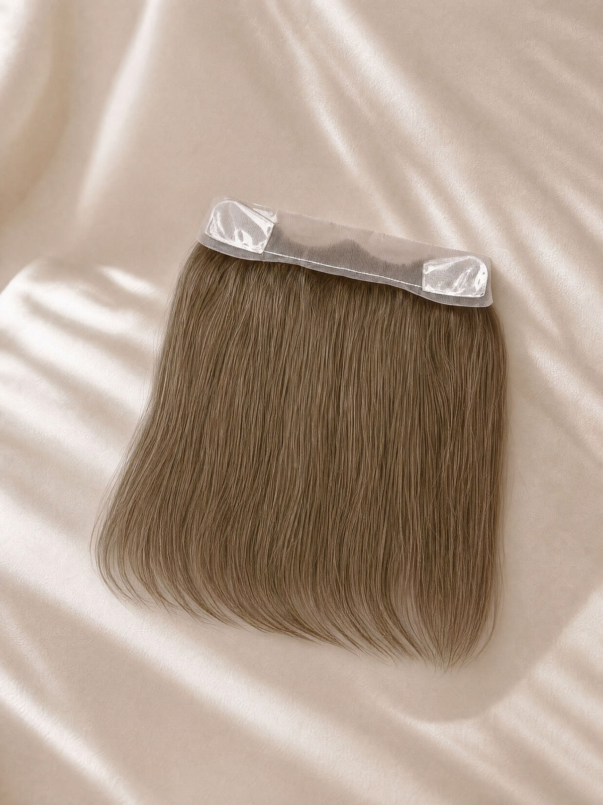 Lace hairline topper with smooth light brown hair and clear lace base tabs