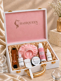 Wig kit open box with pink satin bonnet, edge control, melting spray bottles, brush and lace band