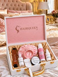 Wig kit open box with pink bonnet, edge control, melting spray, glue, brush and lace band