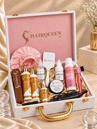 Luxury wig kit open with satin wig cap, brush, gold-handled tools, and hair products
