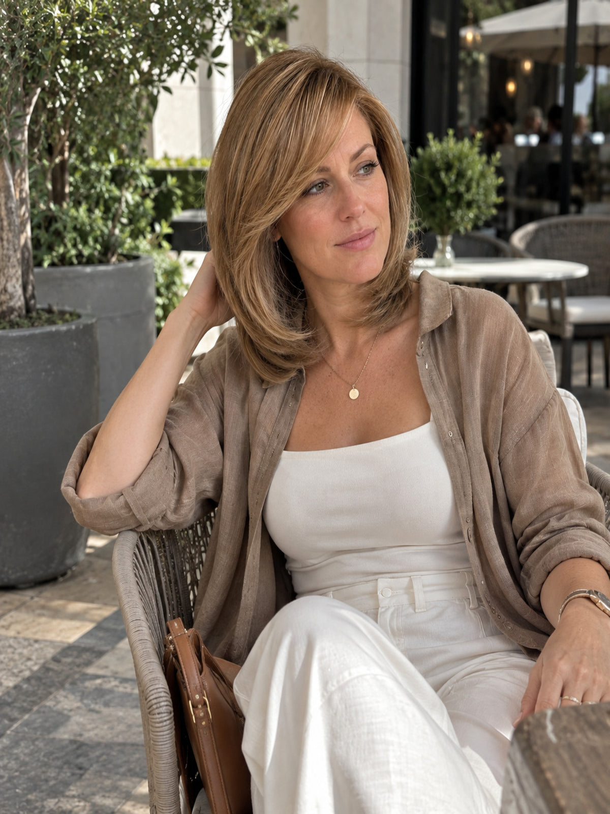 Beige-brown lace-front wig with fine mono top, shoulder-length styled hair on model.