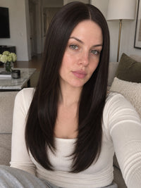 Dark long lace-front wig on model, center-parted sleek hair framing face