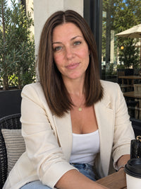 Shoulder-length medium brown lace-front wig with center part, worn by model