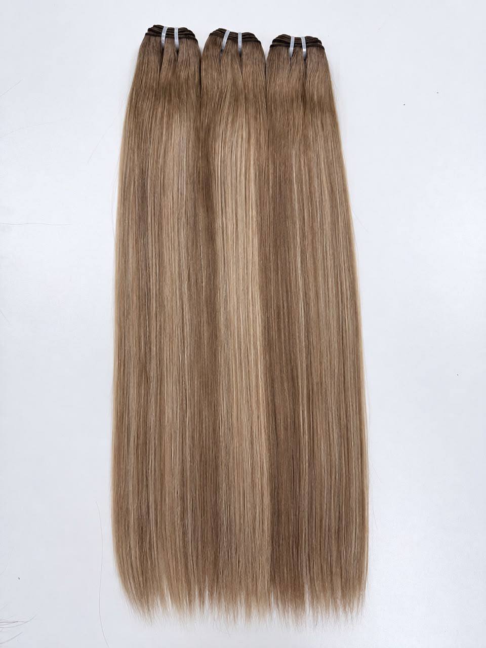 Straight hair bundle set in champagne blonde with subtle warm highlights